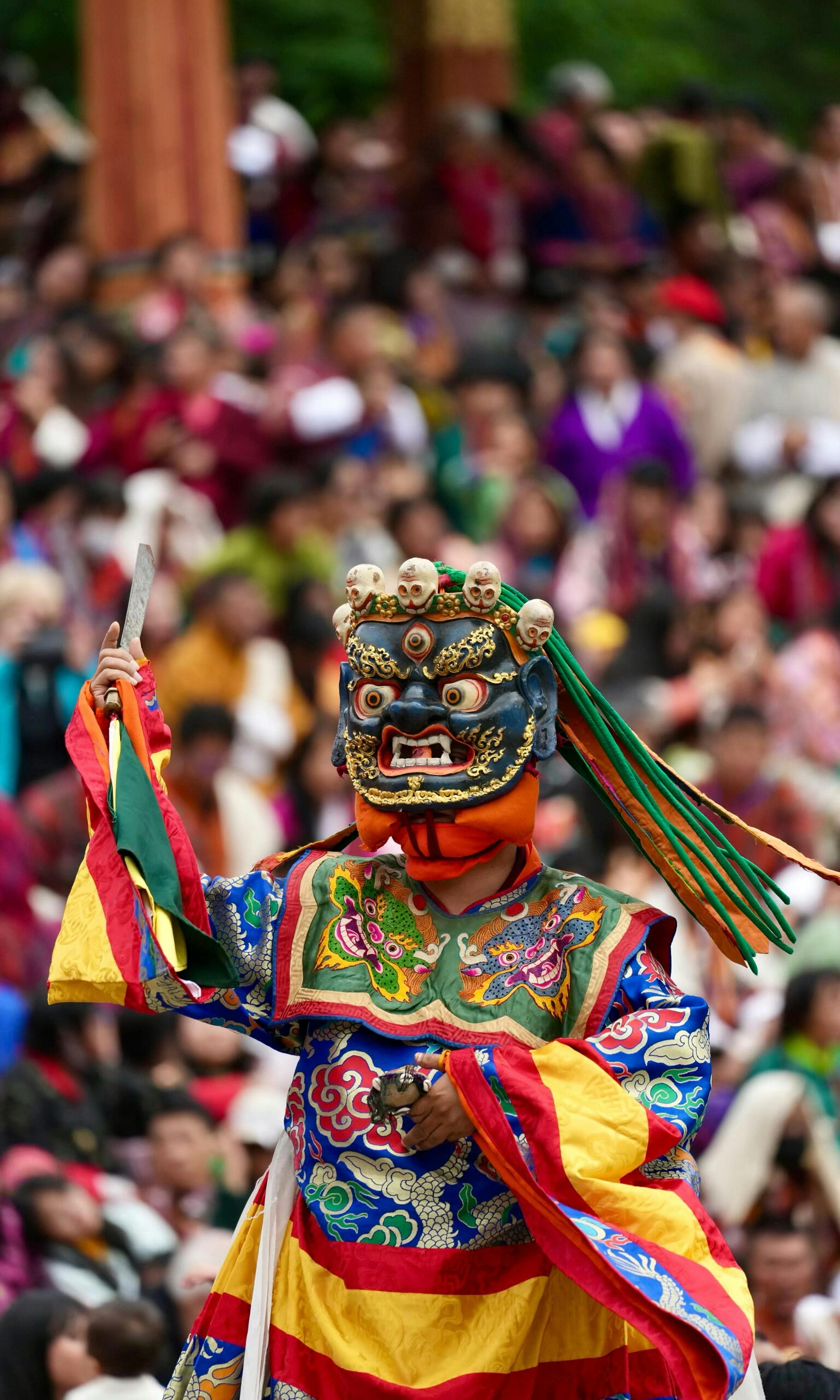 Bhutanese mask dancers performing a traditional Tshechu ritual